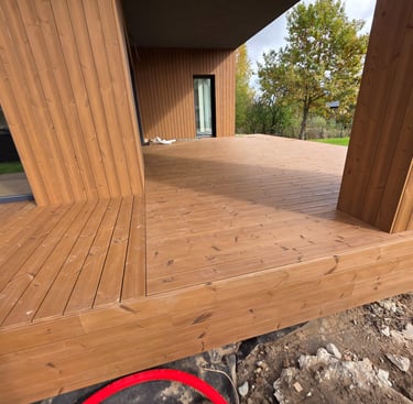 a wooden deck with a red circle in the middle