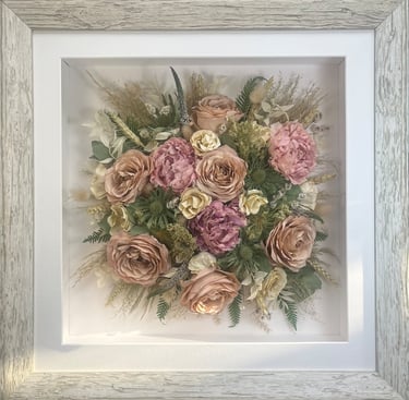 Birdseye view preserved wedding bouquet in a washed white frame