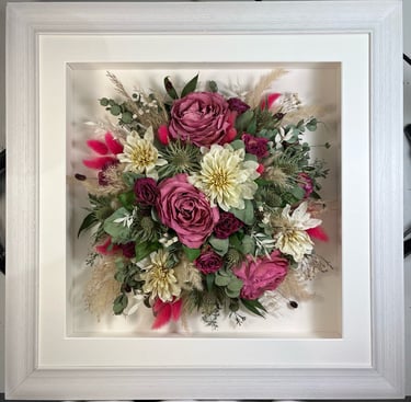 a Birdseye view preserved wedding bouquet in a frame