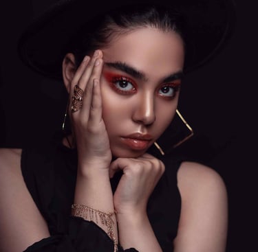 a woman with a stunning makeup and look
