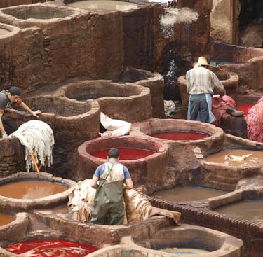 a group of people working in a tannery