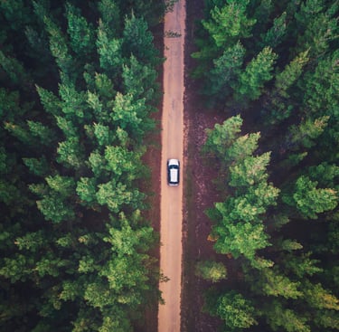 A car driving down a long road
