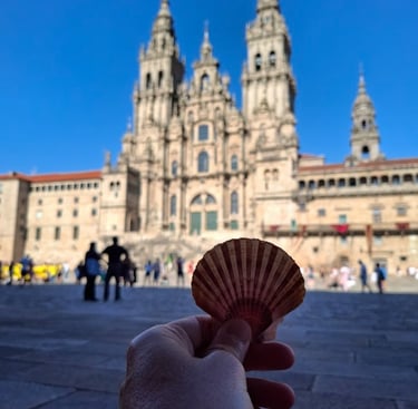 a person holding a shell shellfish in front of a large building
