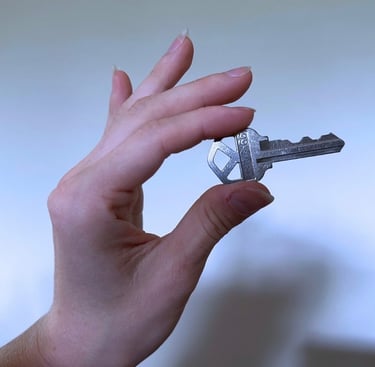  key duplication in Asheville NC with hand holding key