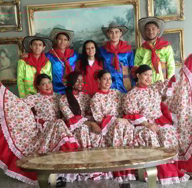 a group of people in colorful costumes posing for a photo
