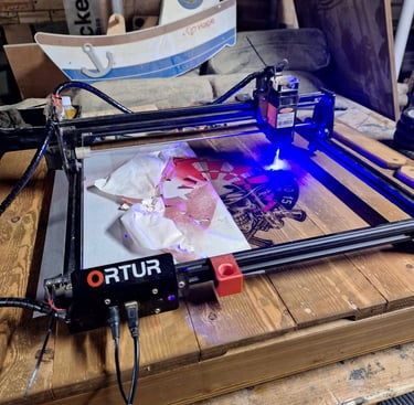 a laser printer engraving an image on to wood