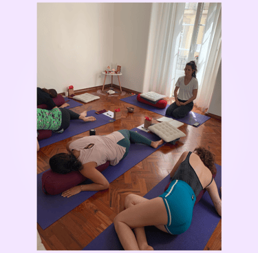 Lucy guiding yoga students during Restorative Yoga in Lisbon, Portugal.