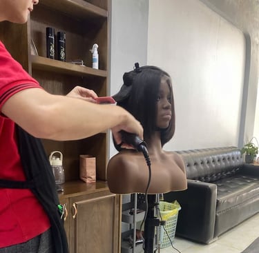 Stylist finishing a Vietnamese human hair bob wig at Vietsilkhair.