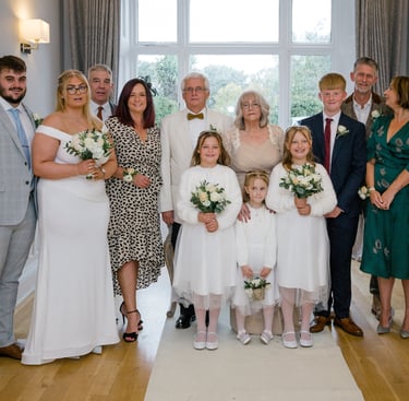Family Photograph At The End Of Their Renewal Of Vows Ceremony