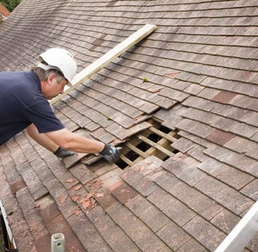 A roof leak in the process of being repaired