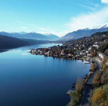 droneshot village with lake millstatt