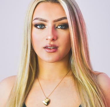 a woman with blonde hair and a green dress