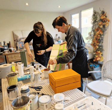Image of 2 ladies participating in a Beginner's furniture painting workshop with Absolutely Mintage