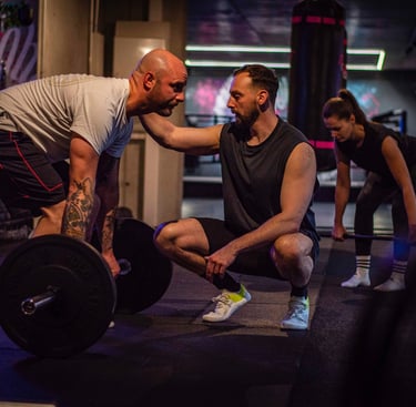a man and a woman doing a squat - squat