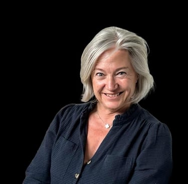 This is an image of Cecile Molinas smiling on a black background