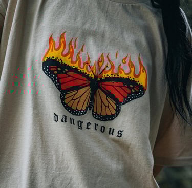 a woman with a butterfly butterfly on a white shirt