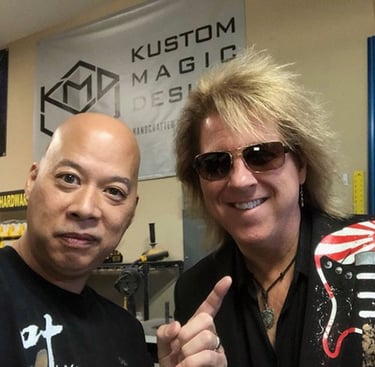 Ray Lum and David Starr posing at Kustom Magic Design, David Starr with sunglasses