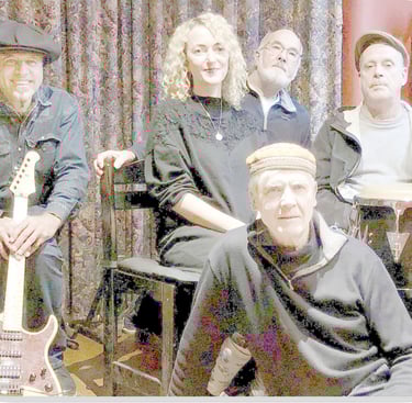 Faded photo of five-piece band relaxing