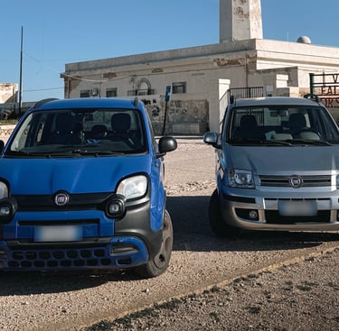 two cars parked in front of a building