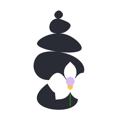 A black rock cairn with a white orchid which has a lavender & tangerine center