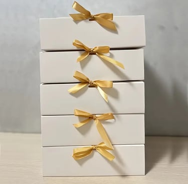 gift box with white and gold bow