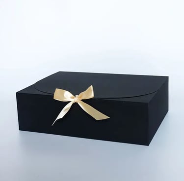 gift box with black and gold bow