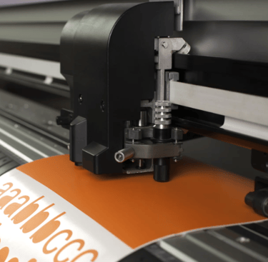 a cutter plotter cutting adhesive vinyl