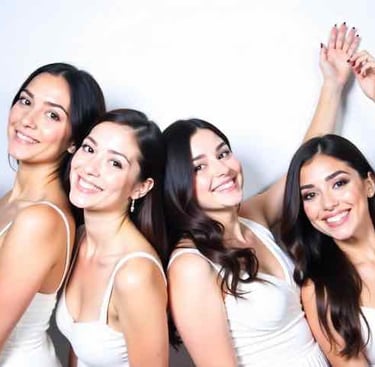 Party guests laughing in a photo booth in Bakersfield.
