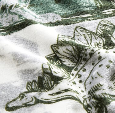 Polyester dino printed fleece fabric swatch