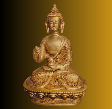 a golden buddha statue sitting on a gold pedestal
