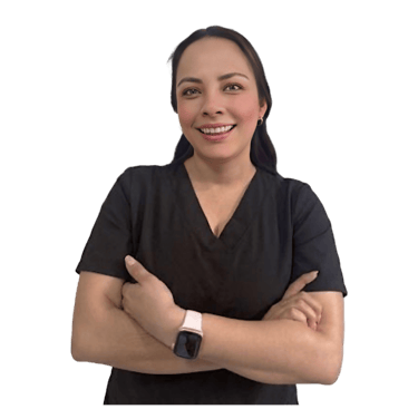 Smiling female healthcare professional in black medical scrubs with arms crossed against a white background.