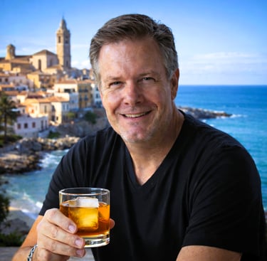 Photo of the author with a Spanish seaside old town in the background