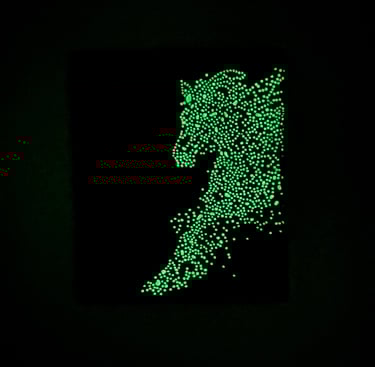 Glow-in-the-dark green dotted horse silhouette art on a black background for wall decor.