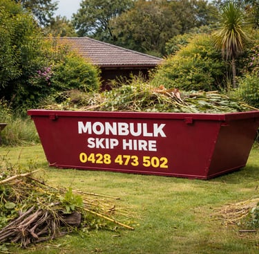 overgrown front yard of a house with a maroon monbulk skip bin loaded with green waste