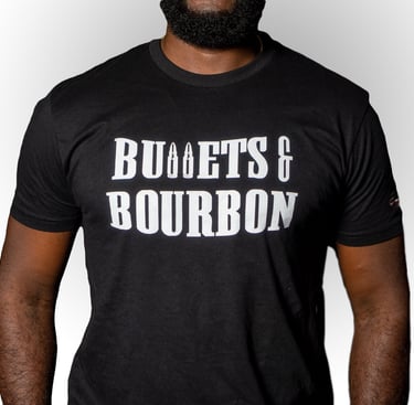 a man in a black shirt with the words Bullets & Bourbon