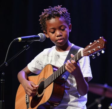 A group of dancers mid-motion, their colorful costumes swirling in vibrant energy.