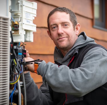 Engineer installing a heat pump