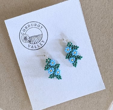 Beautifully hand beaded sky blue floral garland earrings made with Czech glass beads