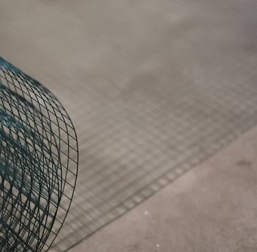 Chicken wire rolled out on the floor