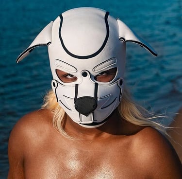 Person posing in a pup mask.