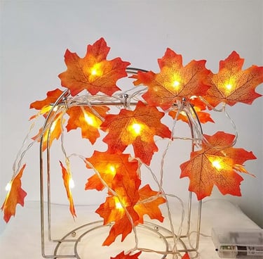 Battery-operated maple leaf string lights with 20 warm orange LEDs on a 9.8ft copper wire,