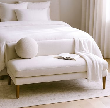 Compact linen settee in a cozy reading corner with natural shadows, a book, and a warm light atmosphere.