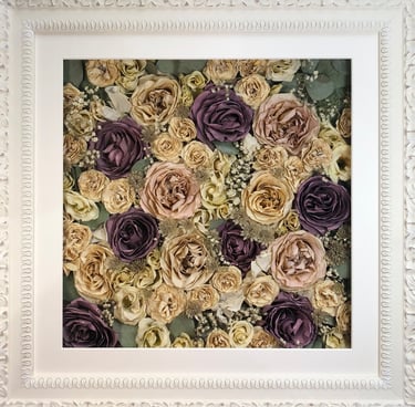 a Flower Wall Style bouquet of flowers in an ornate white frame