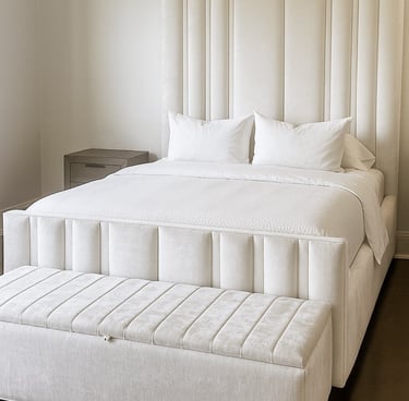 Bedroom with vertical upholstered wall panels in a soft neutral tone by Solo Home Decor