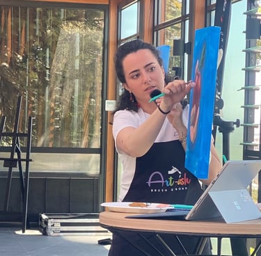 an artist instructing a painting session