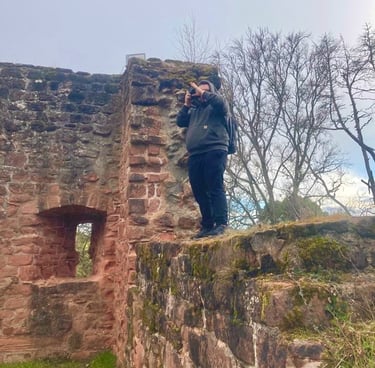 a man taking a picture of a woman taking a picture of herself