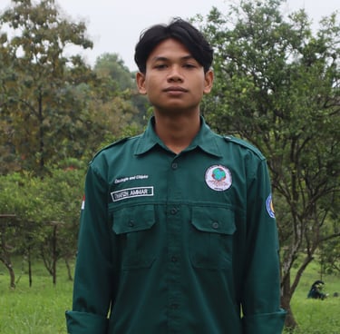 a man in a green uniform standing in a field
