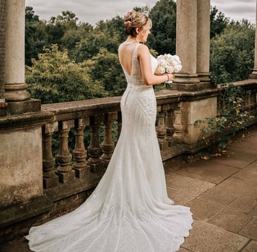 Bride in elegant backless wedding dress captured by Fred Art Studio in London garden