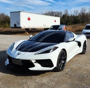 White corvette with hood and roof wrap