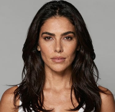 Elegant party decoration with pastel balloons and floral arrangements in a cozy living room.